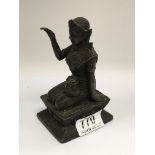 A Tibetan bronze kneeling figure. 14cm