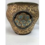 A Doulton jardiniere decorated with stylised flowers .25 cm