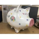 A large pottery pig money box.