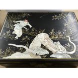 A jewellery box decorated The top decorated with a