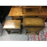 A small carved oak slipper box and a small circular folding table.