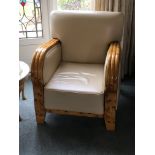 A pair of Maple and leather Art Deco design arm chairs with white cream leather upholstery.