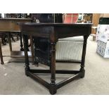 An early oak hall table having triangular base and circular top - NO RESERVE