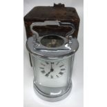 An unusual circular design chrome plated 4 glass carriage clock and case.