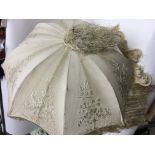 A turned ivory and embroidered folding silk parasol by Sangsters c.1890.