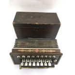 A wooden cased French Flutina accordion with mother of pearl keys and painted decoration.Approx