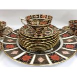 A collection of Royal crown derby comprising 5 cups six saucers six side plates and one larger