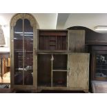 A Art Deco cabinet with bureau With glazed and blind doors and open sections. 140 cm by 140 cm