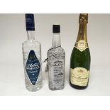 A bottle of Jack Daniels Winter Jack, a bottle of Champagne, and a bottle of Antica Sambuca (3)