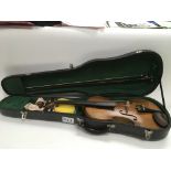 A cased Russian violin circa 1850, possibly a Rigart Rubus. Supplied with a bow.