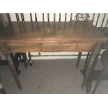 A mahogany card table the twin flap top above ring turned legs - NO RESERVE