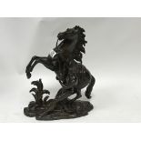 A 19th Century bronze Marley horse figure signed Coustou.