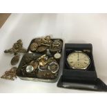 A small collection of cap badges buttons and a Ingersoll watch