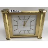 A heavy polished brass Tiffany &Co. quartz alarm clock.
