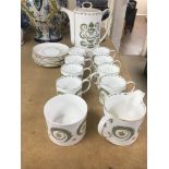 A Susie cooper coffee set Assyrian motif comprising 8 cups and saucers milk jug sugar pot and coffee