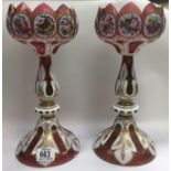 A paid of Bohemian Cranberry glass lustres ( complete with crystals drops). H.33.5cm