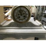 A white marble mantle clock the enamel dial with Roman numerals and visible escapement.28 cm.