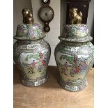 A large pair of reproduction Cantonese vases and covers decorated with figures height 65cm no