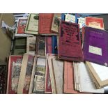 A box of motoring related books and vintage ordinance survey maps.