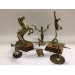 Six brass car mascots comprising a horse, Eros, salmon and others, tallest approx 25cm - NO RESERVE