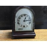 A small Domed topped silvered dial mantle clock wi