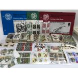 A collection of unused stamps and stamp sets, cigarette card sets etc.