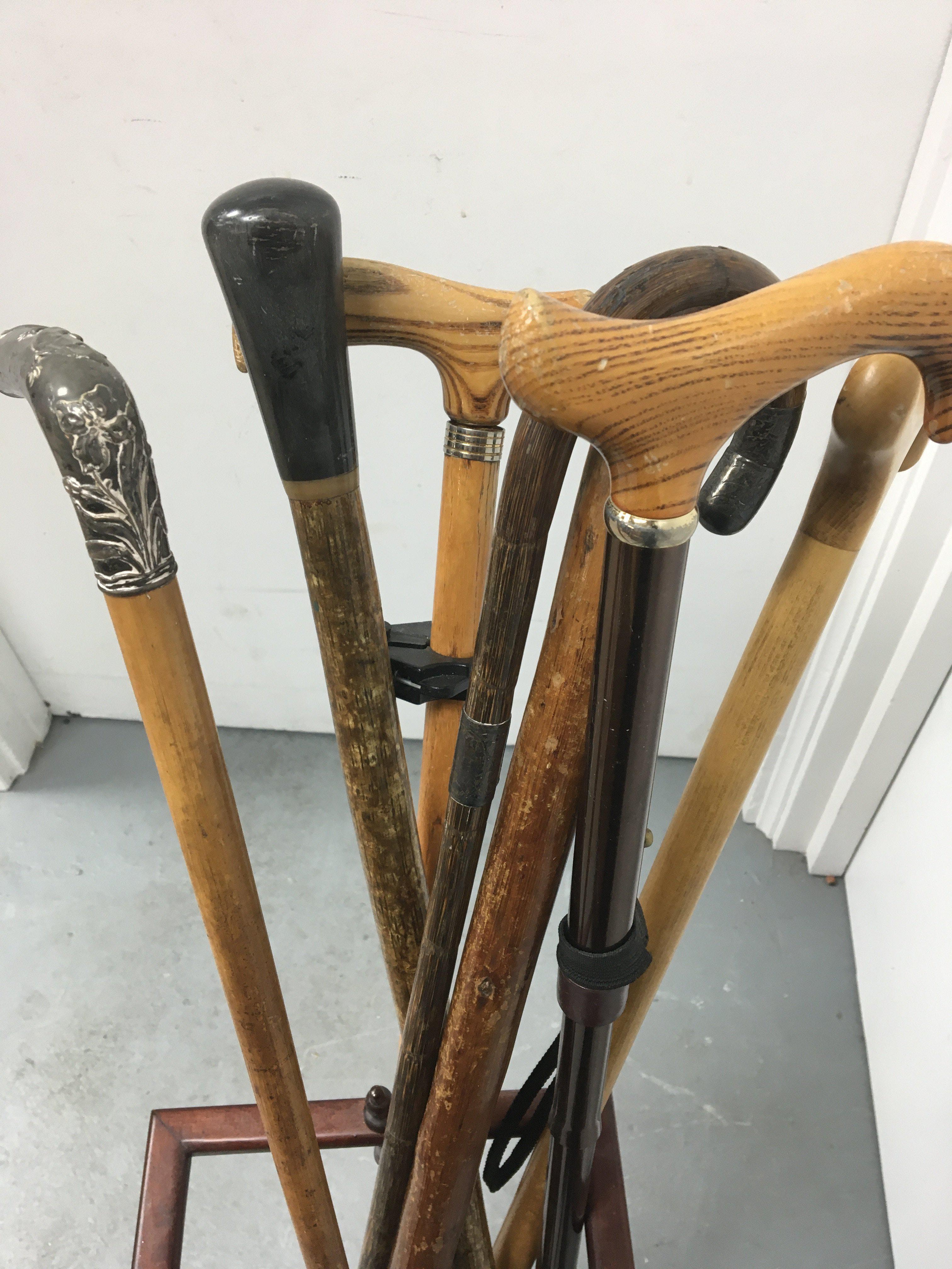 A Chinese silver handle walking cane a collection of other walking sticks in stand . - Image 2 of 3