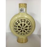 A pottery moon flask with with oriental decoration. 26cm.