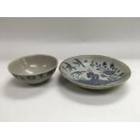 Two Tek Sing blue and white Chinese export porcelain items comprising a tea bowl and a dish, some