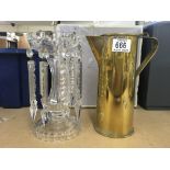 A cut crystal lustre 22.5cm and a trench art brass water jug.