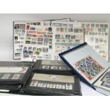 A collection of stamps including two albums of unused British Decimal Mint Stamps and three albums