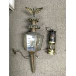 A brass coaching lamp and a small miners lamp.