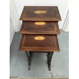 A nest of three Edwardian style mahogany tables with banded inlay on turned legs United by