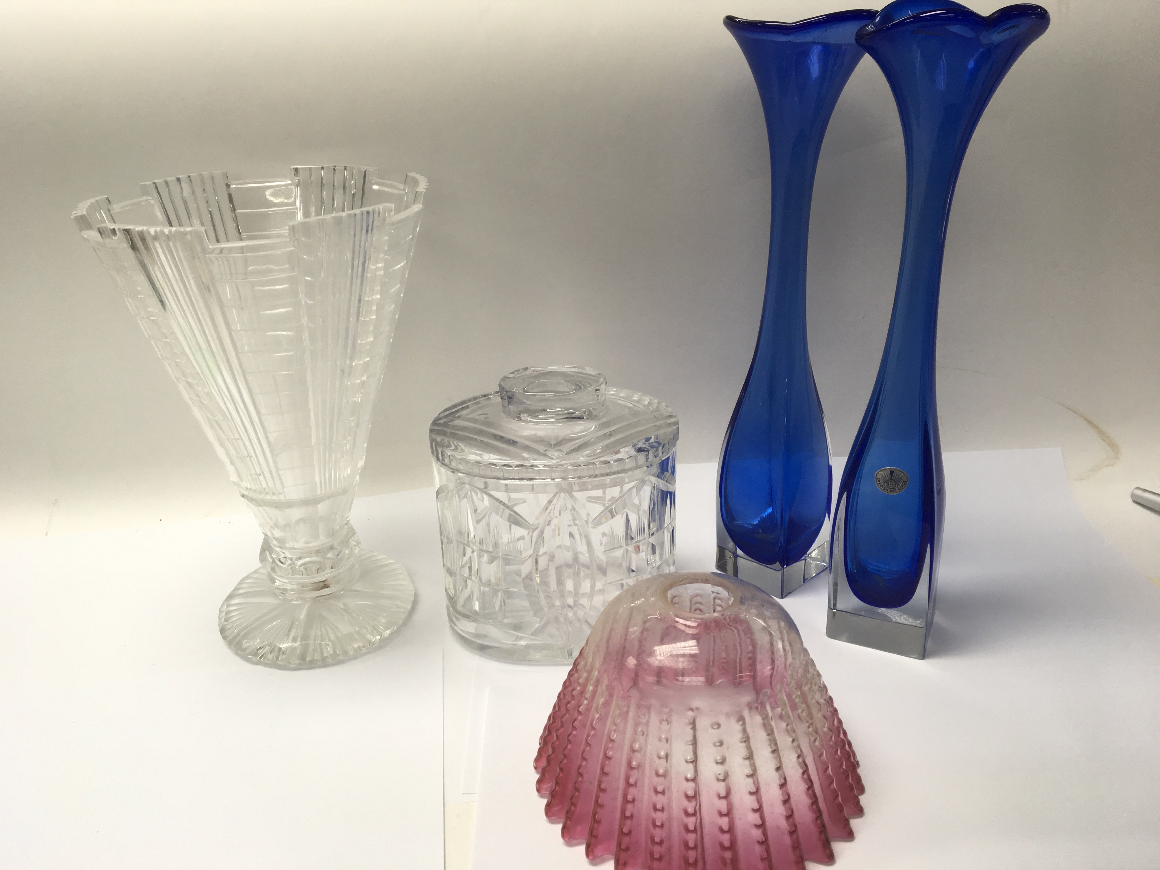 A collection of glassware including an early 20th century cranberry and opalescent glass dish with a
