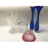 A collection of glassware including an early 20th century cranberry and opalescent glass dish with a