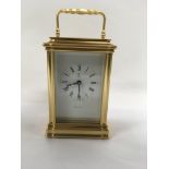 A griffin gilt case carriage clock 12 cm