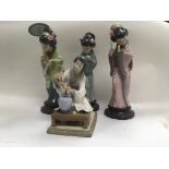 A collection of four Lladro figures in the form of no damage or restoration