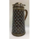 A large Doulton Lambeth pottery tankard/Jug with silver plated cover.26cm