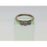 A 9ct gold and platinum three stone diamond ring, approx 1.9g and approx size L-M.