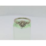 A ladies 9ct white gold diamond cluster ring, approx.20ct, approx 2.1g and approx size N.