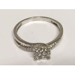 An 9carat gold ring set with a pattern of diamonds ring size O,