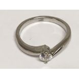 A Platinum (900) modern design ring set with a solitaire brilliant cut diamond. Ring size K.