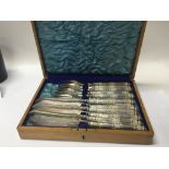 A cased set of late Victorian silver plated fish knifes and folks in an oak case - NO RESERVE