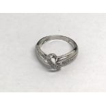 A ladies 9ct white gold ring set with diamonds, approx 1.8g and approx size J-K.