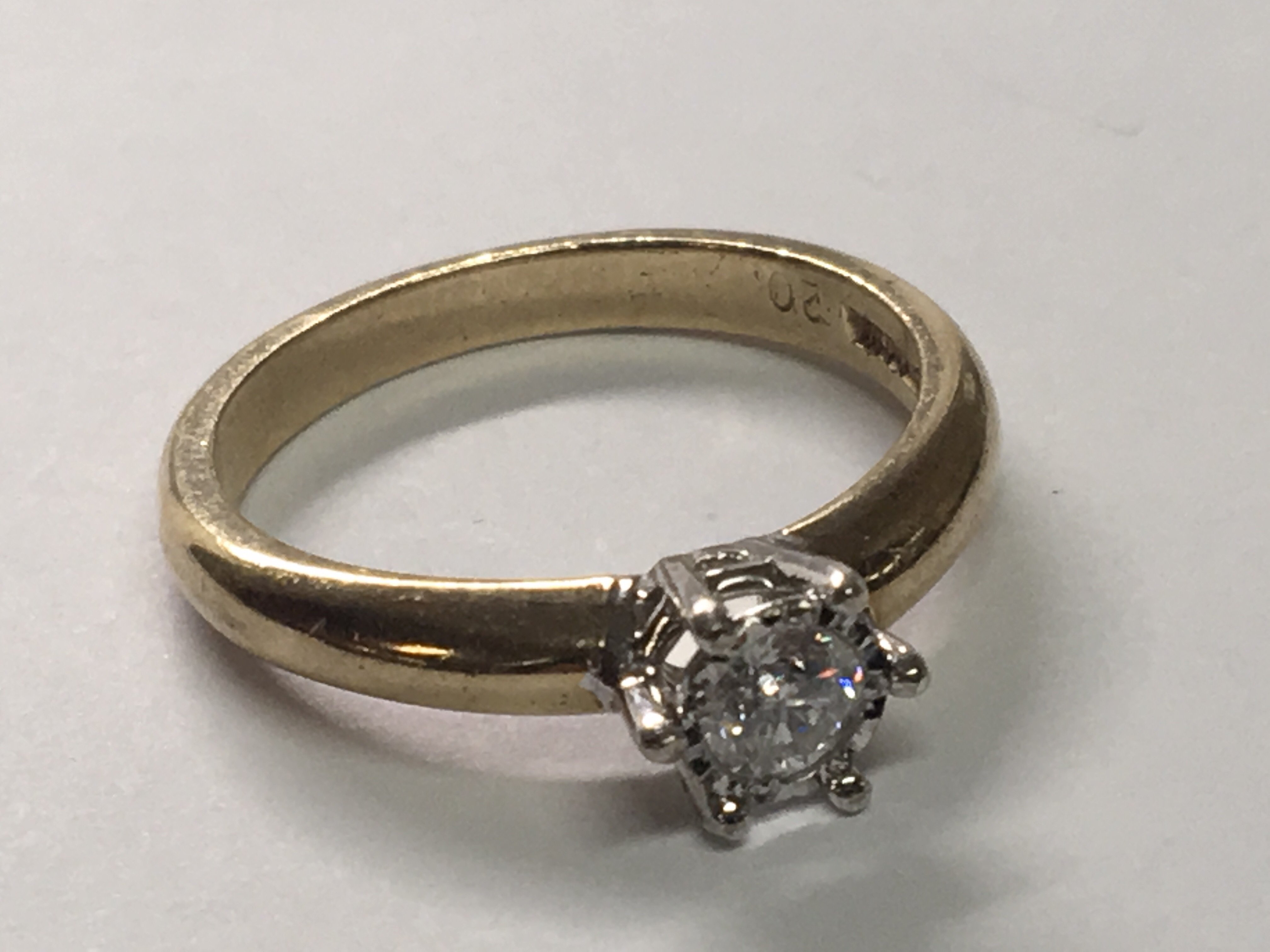 A 9carat gold solitaire diamond ring the brilliant cut diamond approximately 0.20 carat.