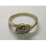 An 18carat gold ring set with three brilliant cut diamonds. Ring size T-U