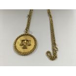 A 18 ct gold pendant and chain 35 grams approx .