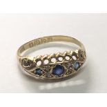 An Edwardian 18carat gold ring set with blue sapphire and diamonds. Ring size N.