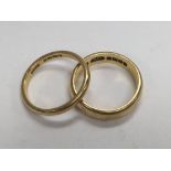 2 22ct gold wedding bands approximately 10g.