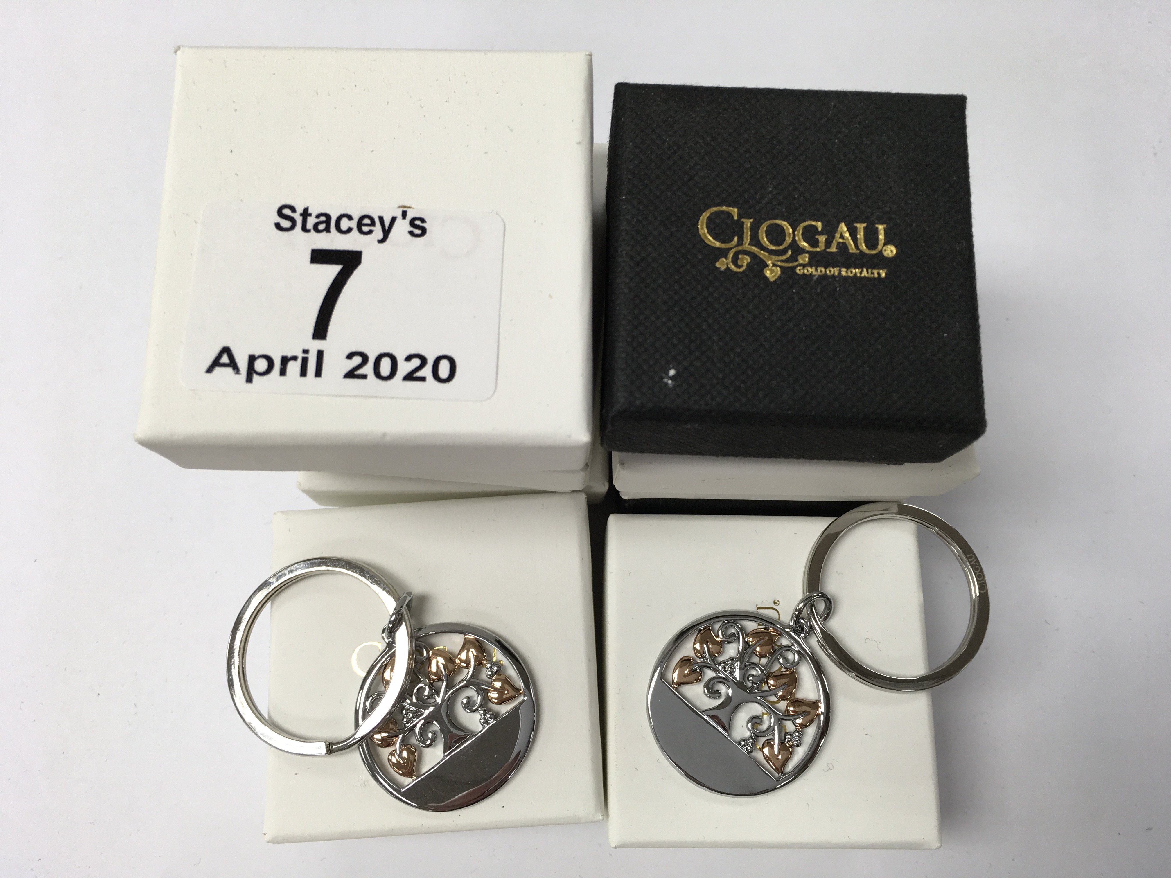 8 identical boxed Clogau key ring pendants.